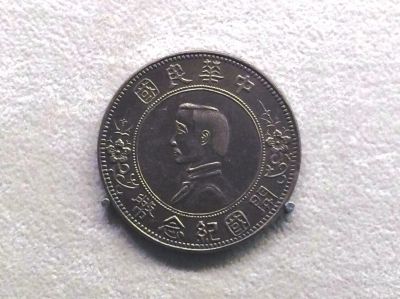 申德林称，中国钱币博物馆内展示的这枚纪念币与“传家宝”一模一样。
