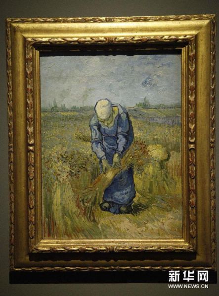 这是1月23日在比利时蒙斯展出的梵高的作品《收麦子的人》。